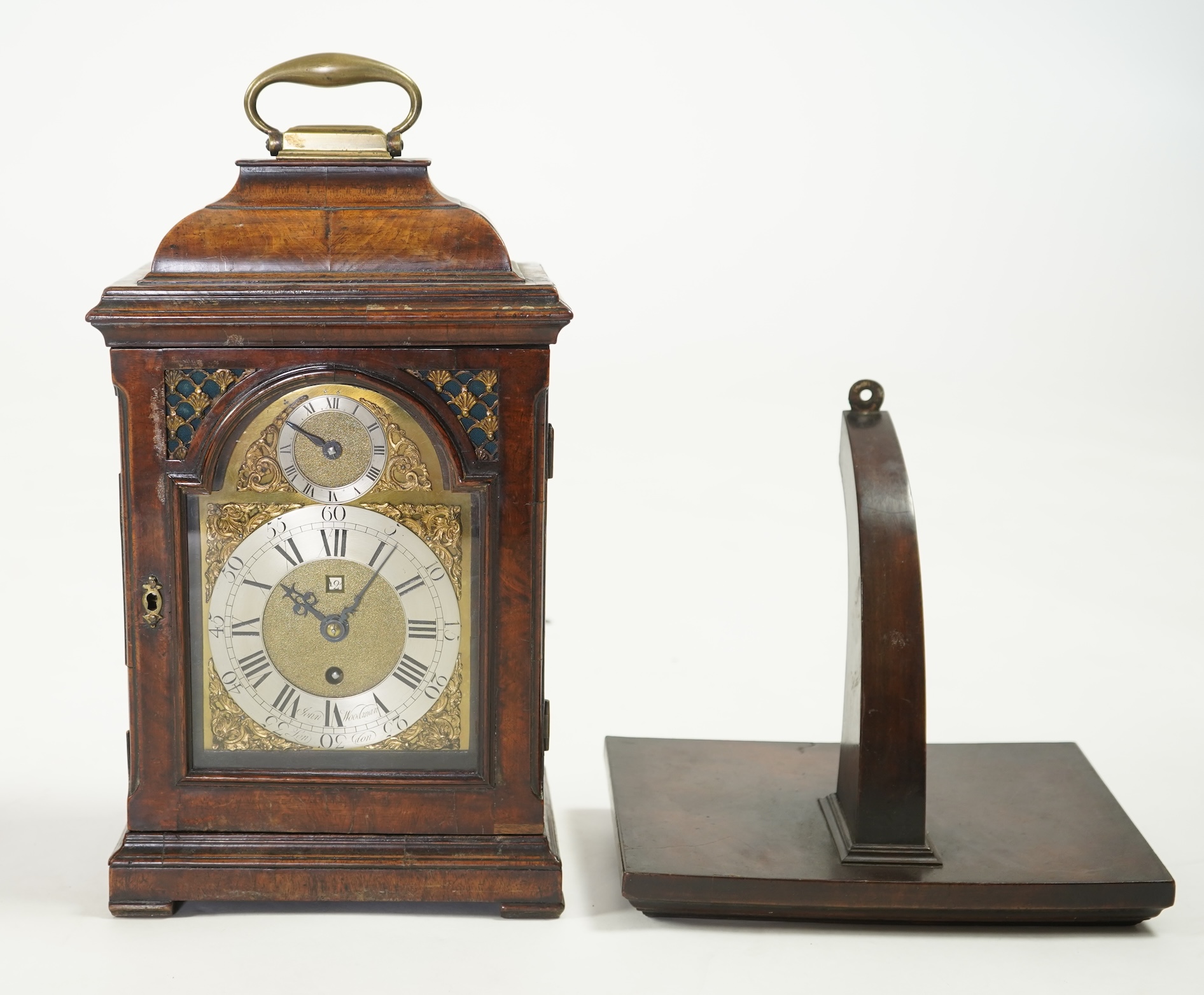 A George II walnut and brass mounted bracket clock, signed John Woodman